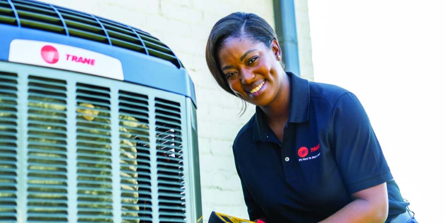 Female Tech working on Trane unit